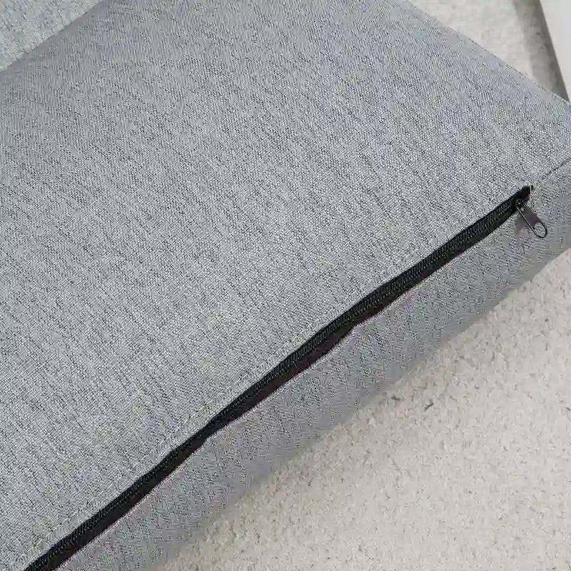 Chaise longue de sol pliable grise avec oreiller