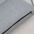 Chaise longue de sol pliable grise avec oreiller