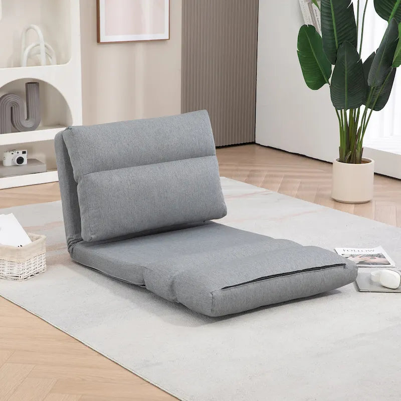 Chaise longue de sol pliable grise avec oreiller