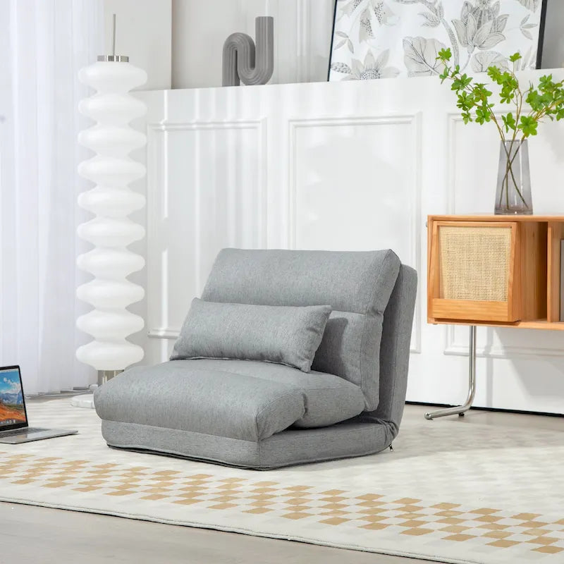 Chaise longue de sol pliable grise avec oreiller